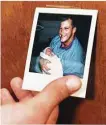  ?? Staff file photo ?? Then-Oilers tackle David Williams shows off a photo of himself holding his newborn son Scot 25 years ago.