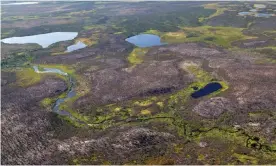  ?? Photograph: Barry Vincent/Alamy Stock Photo ?? A river meanders by an esker in northern Manitoba, Canada. The manhunt is focused on the rugged terrain around the town of Gillam.