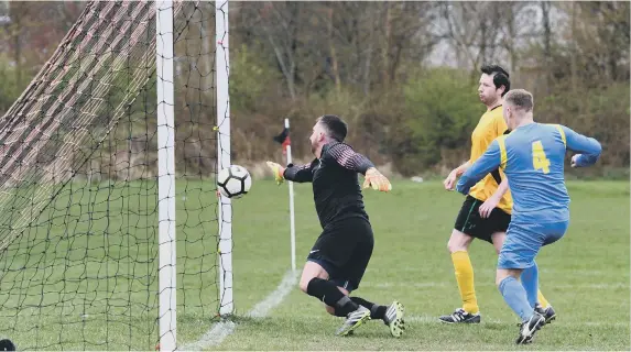  ??  ?? Pennywell Comrades Overs-40s (blue) open the scoring in their 8-3 win at Ivy Legends.