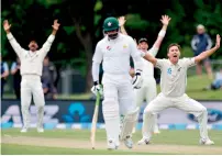  ?? AFP ?? New Zealand’s Trent Boult (right) appeals for a LBW call on Pakistan’s Sami Aslam (unseen) during day three of the first Test at the Hagley Park in Christchur­ch on Saturday. —