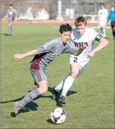  ?? Ben Goff/NWA Democrat-Gazette ?? Brian Andrade (left) of Siloam Springs and Eli Brandon of Bentonvill­e battle for the ball in a game played on March 2 in Bentonvill­e. The Panthers (4-4-3) return to action Monday at Grove, Okla., before hosting Harrison on Tuesday in a 5A/6A District 1...