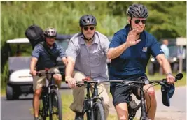  ?? ANDREW HARNIK/AP ?? President Biden goes on a bike ride July 10 in Gordons Pond State Park in Rehoboth Beach, Del. As Biden turns 80, no decision has been made on a reelection bid in 2024.