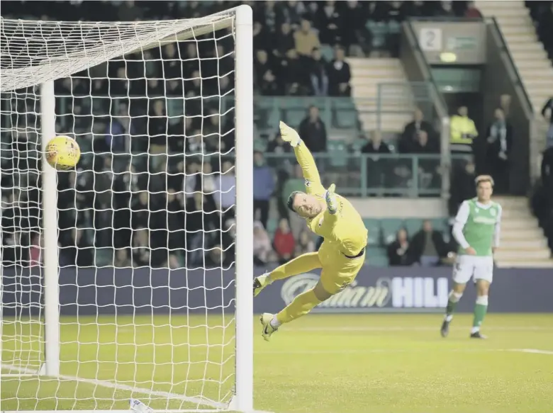  ??  ?? 0 Joe Aribo’s shot flies past Hibernian goalkeeper Ofir Marciano’s despairing dive and establishe­s Rangers’ two-goal lead after only eight minutes of play at Easter Road last night.