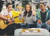  ?? Cliff Lipson CBS ?? BONDING are “Happy Together’s” Felix Mallard, left, Amber Stevens West and Damon Wayans Jr.