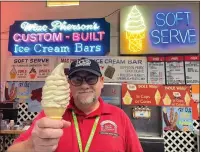  ?? DAVID ALLEN — STAFF ?? Schuyler MacPherson holds a soft serve cone at his family’s food stand at the L.A. County Fair. He’s the fourth generation to own MacPherson’s Ice Cream, a presence at the fair since 1922.