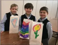  ?? PHOTO FROM ST. TERESA OF CALCUTTA PARISH SCHOOL ?? Each student decorated a white paper bag and then filled it with items such as fruit juices, whole grain bars, instant oatmeal and trail mix. The breakfast bags were completed and dropped off at the Open Door Ministry in Royersford.