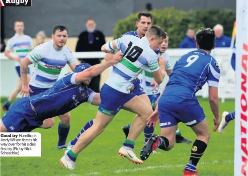  ??  ?? Good try Hamilton’s Andy Wilson forces his way over for his side’s first try (Pic by Nick Schaschke)