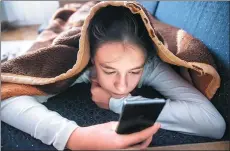  ??  ?? Banned at bedtime? Screen time late at night affects sleep patterns.