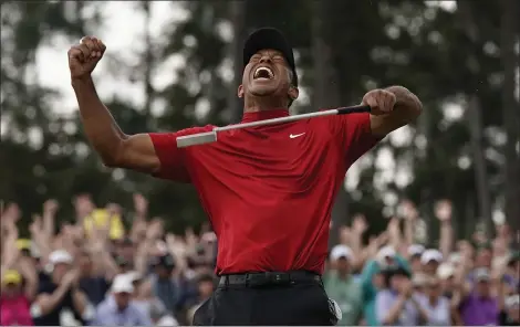  ?? DAVID J. PHILLIP — THE ASSOCIATED PRESS ?? Tiger Woods wins the Masters on April 14, 2019, at Augusta National in Augusta, Ga.