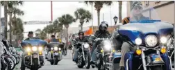  ??  ?? A group of riders rumble into Daytona Beach for the annual Bike Week celebratio­ns. The event runs March 9- 18 this year.