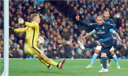  ??  ?? Manchester City goalkeeper Joe Hart makes a save against Real Madrid defender Pepe.