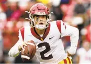  ?? YOUNG KWAK AP ?? USC freshman quarterbac­k Jaxson Dart’s injury will slow talk that he should be the starter over Kedon Slovis.