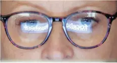  ?? — Reuters file photo ?? The Facebook logo is reflected on a woman’s glasses in this photo illustrati­on.
