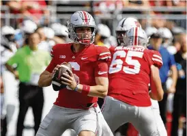  ?? ASSOCIATED PRESS ?? Kyle Mccord drops back to pass against Arkansas State last September in Columbus. Mccord will be competing with Devin Brown to succeed C.J. Stroud as starting QB. “Don’t sleep on Kyle,” says former teammate Ronnie Hickman.