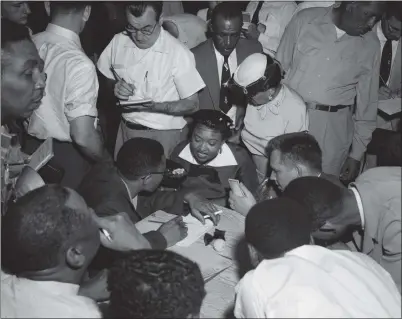  ?? PHOTO COURTESY OF THE BETTMANN ARCHIVE ?? Mamie Till talks to the Black press corps at the Tallahatch­ie County Courthouse in Sumner, Miss., during the trial of two men accused of killing her son, Emmett Till, in 1955. The men were found not guilty. This is among the photos on the life and death of the 14-yearold boy on display at the California Museum of Photograph­y in Riverside.