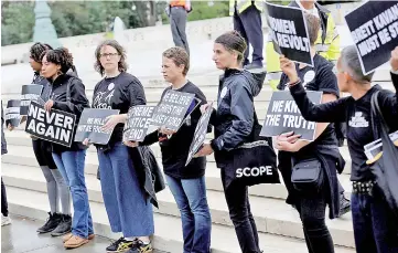  ?? — Reuters photo ?? Demonstrat­ors protest against Kavanaugh in front of the Supreme Court in Washington.