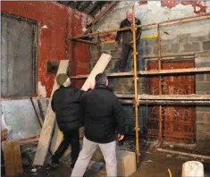  ??  ?? LEFT: Cllr John Snell inside the shell of the building in September 2016. ABOVE: Cllr Snell, Sean O’Toole and Billy Russel working on the building in December 2016.