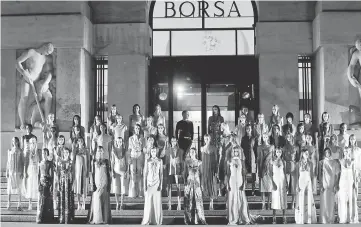  ??  ?? Models parade in front of Milan’s stock exchange at the end of the Ferragamo Spring/ Summer 2018 show at the Milan Fashion Week in Milan, on Saturday. (Below) Models walk at the end of the Missoni show. — Reuters photos