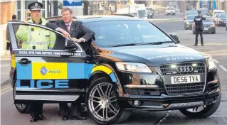  ??  ?? HOT WHEELS The then assistant chief constable John Neilson and Kenny MacAskill, who was justice secretary, with seized Audi in 2010