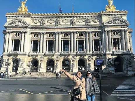  ??  ?? TAKES THE CAKE:
Zola Nene and her friend Galatea Apostolell­is in front of the Palais Garnier, the opera house in Paris, left; and below, inside a Pierre Hermé boutique