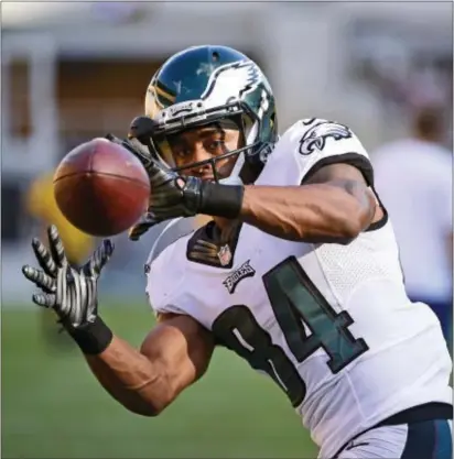  ?? THE ASSOCIATED PRESS FILE ?? Eagles receiver Marcus Johnson, here looking a pass into his hands in a preseason game against the Pittsburgh Steelers last year, is hoping to be part of a much improved Birds receiving crew this year.