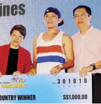  ??  ?? Filipino delegate Filmark “Tohoi” Bernante (center) brought home S$1,000 for being the last Filipino standing.