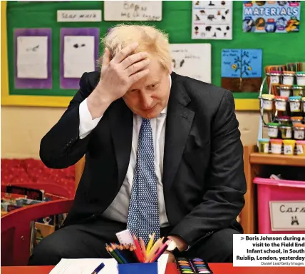  ?? Daniel Leal/Getty Images ?? > Boris Johnson during a visit to the Field End Infant school, in South Ruislip, London, yesterday