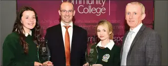  ??  ?? Fergus Clifford Bank of Ireland presenting School Ethos Awards to Niamh O’Sullivan and Andrea Houlihan with (right) Colm McEvoy CEO Kerry Education Board at Killorglin Community College on Thursday.