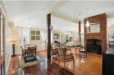  ??  ?? The home features polished wooden floors throughout.