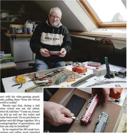  ?? MICHEL SPINGLER/AP ?? Guy Warein, a 70-year-old retiree, works on model trains in his home in Richebourg in northern France.