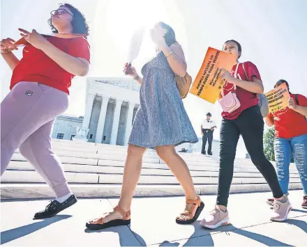  ??  ?? Immigratio­n activists march outside the Supreme Court on Thursday, the last day of the term. JIM LO SCALZO/EPA-EFE