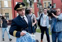  ?? AP ?? Damir Yusupov, 41, the captain of Ural Airlines A321, walks to attend a news conference in Ramenskoye, just outside Moscow, yesterday.