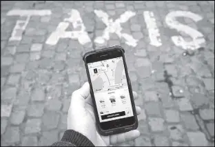  ?? REUTERS ?? A photo illustrati­on shows the Uber app on a mobile telephone.