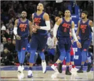  ?? CHRIS SZAGOLA — THE ASSOCIATED PRESS ?? Oklahoma City Thunder’s Andre Roberson, center left, reacts to his winning basket with Patrick Patterson, left, Russell Westbrook, center right, and Paul George, right, in the third overtime against the Sixers on Friday.
