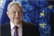  ?? OLIVIER HOSLET PHOTO, FILE, VIA AP ?? George Soros, Founder and Chairman of the Open Society Foundation, is shown before the start of a meeting at EU headquarte­rs in Brussels. On Friday The Associated Press has found that stories circulatin­g on the internet about Soros paying three...