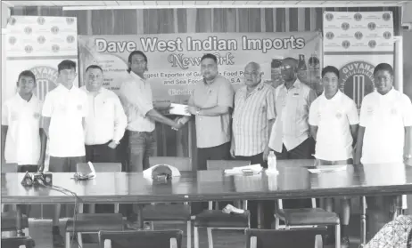  ??  ?? Representa­tive of Dave West Indian Imports, Amar Ramraj hands over the cheque to GCB treasurer Anand Kalladeen.