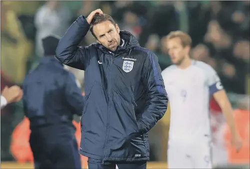  ?? PICTURE: MIKE EGERTON/PA ?? Manager Gareth Southgate looks a little perplexed after England’s win in Lithuania that completed their World Cup qualifying campaign. FOOD FOR THOUGHT: