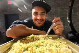  ?? VINCE TALOTTA/TORONTO STAR ?? Steven Gonzalez, the executive chef/ el jefe (boss) of Valdez, a Latino street food restaurant in Toronto, cooks arroz con pollo for the Terroir symposium lunch.