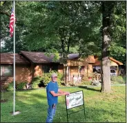  ?? Courtesy photo ?? The first Beaver Shores POA Yard of the Month award for 2018 goes to Tim and Mona Van Pelt. The Van Pelts have lived on White Oak Drive since 1995. During that time they have added many trees, landscapin­g beds, lighting and decks. Their yard was this...