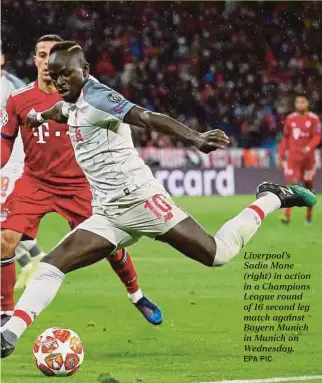  ?? EPA PIC ?? Liverpool’s Sadio Mane (right) in action in a Champions League round of 16 second leg match against Bayern Munich in Munich on Wednesday.