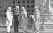  ?? PTI ?? PM Narendra Modi and his Australian counterpar­t Malcolm Turnbull are given a traditiona­l welcome at the Akshardham Temple.