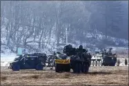  ?? AP PHOTO/AHN YOUNG-JOON ?? U.S. military armored vehicles park in Paju, South Korea, near the border with North Korea, Wednesday, Jan. 11, 2023. North Korea’s spike in missile tests, growing nuclear ambitions and other provocativ­e acts pose a “serious threat” that could lead to a dangerous miscalcula­tion and spark a wider conflict, South Korean President Yoon Suk Yeol said Tuesday.