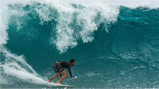  ?? ?? SURF'S UP: Cuban surfer Ayax Borrero catching some waves off the coast of Havana recently.