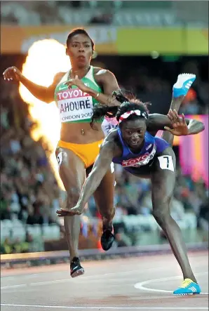  ?? DAVID J. PHILLIP / AP ?? Tori Bowie of the United States tumbles to the track after winning the gold medal in Sunday’s women’s 100m final at the World Athletics Championsh­ips in London.