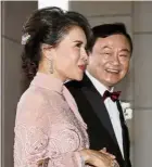  ??  ?? A royal friendship: Thaksin with Ubolratana as they arrive at the wedding in Hong Kong. — AP