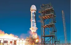  ?? AFP ?? The New Shepard booster of Blue Origin. Virgin Galactic and Blue Origin say they are just months away from their first out-of-this-world passenger flights.