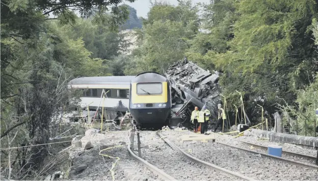  ?? ?? Part of the wreckage of the train after the derailment