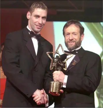  ??  ?? Matty Forde receiving his All Star award from G.A.A. President Seán Kelly in 2004.