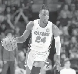  ?? MATT STAMEY/AP ?? Florida guard Phlandrous Fleming Jr., dribbling against Arkansas during a Feb. 22 matchup, caught fire Saturday against Georgia.