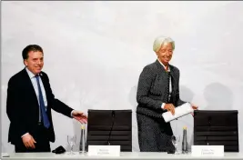  ?? ASSOCIATED PRESS ?? CHRISTINE LAGARDE (RIGHT), Internatio­nal Monetary Fund Managing Director, and Argentina Treasury Minister Nicolas Dujovne arrive for a press conference during the G20 meeting of Finance Ministers and Central Bank governors in Buenos Aires, Argentina, Saturday.